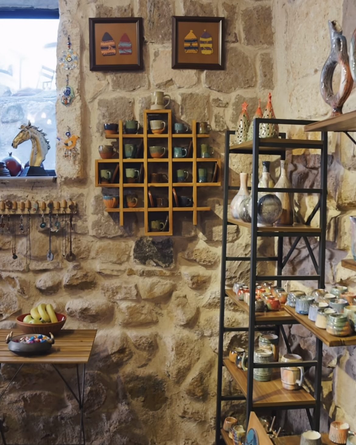 Handmade ceramics displayed in the stone-walled shop of The Çanak workshop